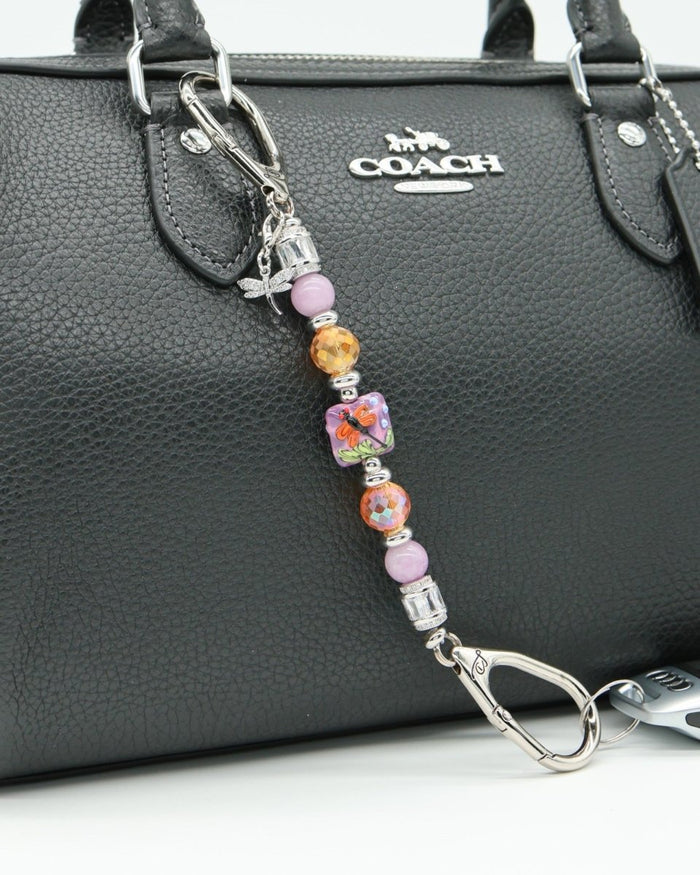 LD Keyfinder Petite Dragonfly Magic keychain with purple lepidolite, orange glass beads, and a lampwork dragonfly centerpiece.