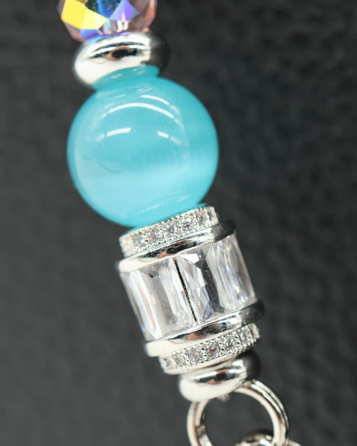 LD Keyfinder Petite Garden Serenade featuring aqua cat's eye, pink glass beads, and platinum-plated baguette rhinestones