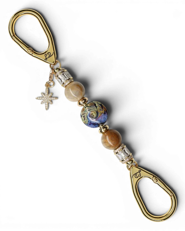 LD Keyfinder Petite Golden Nebula key chain with artisan glass bead, fossil coral, gold accents, and star charm.