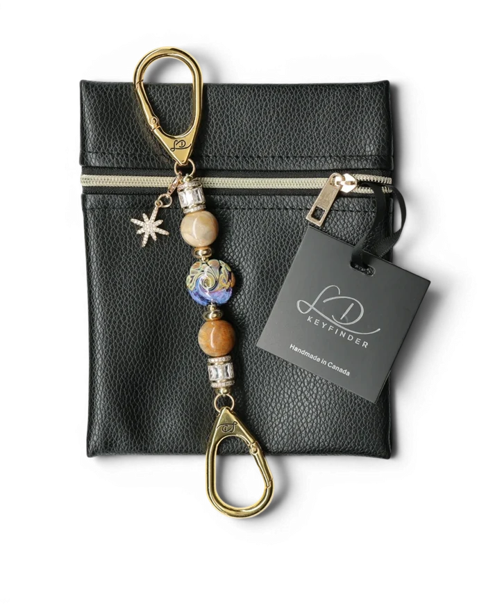 LD Keyfinder Petite Golden Nebula keychain with artisan glass bead, fossil coral, gold-plated spacers, rhinestones, and star charm.