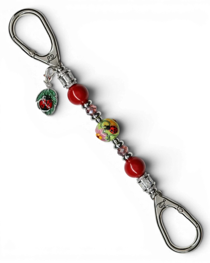 LD Keyfinder Petite Ladybug Love key finder with artisan glass bead, red shell pearls, and silver-plated ladybug charm.