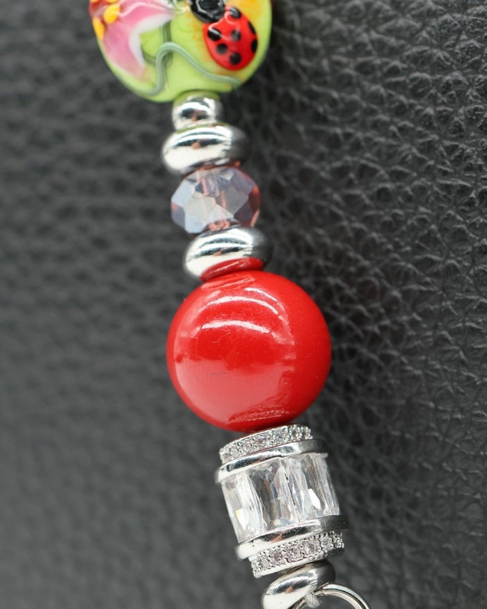 LD Keyfinder Petite Ladybug Love featuring artisan glass ladybug bead, red shell pearls, and baguette rhinestones.
