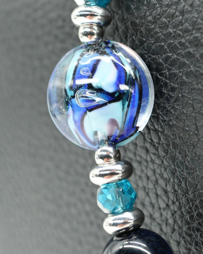LD Keyfinder Ocean Mosaic Petite featuring a blue artisan glass bead, tiger eye gemstones, and silver ocean charms.