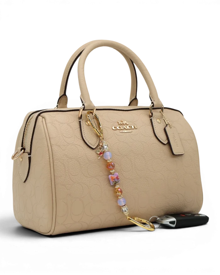 LD Keyfinder Petite Opalite Bloom keychain with pink opalite, burnt orange glass beads, and hummingbird charm.
