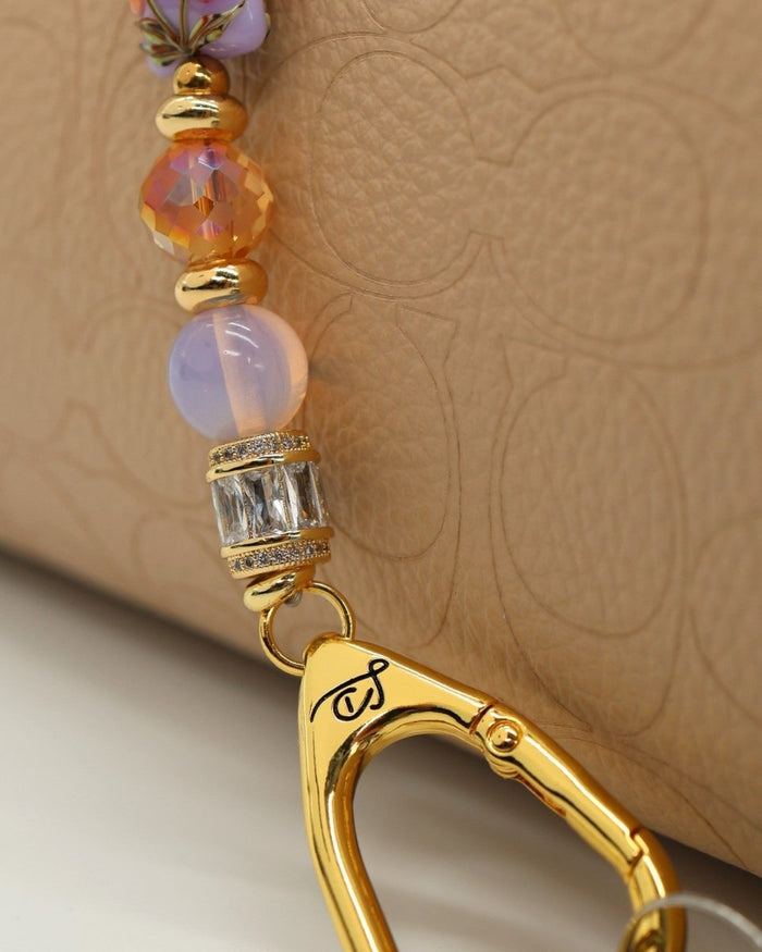 LD Keyfinder Petite Opalite Bloom lanyard with pink opalite, orange glass beads, and gold-plated charm.