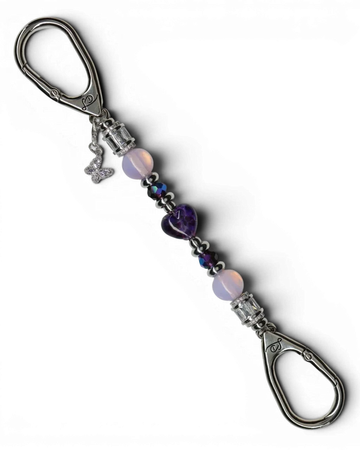 LD Keyfinder Petite Orchid Flutter with pink opalite, dark orchid glass beads, and a purple rhinestone butterfly charm.