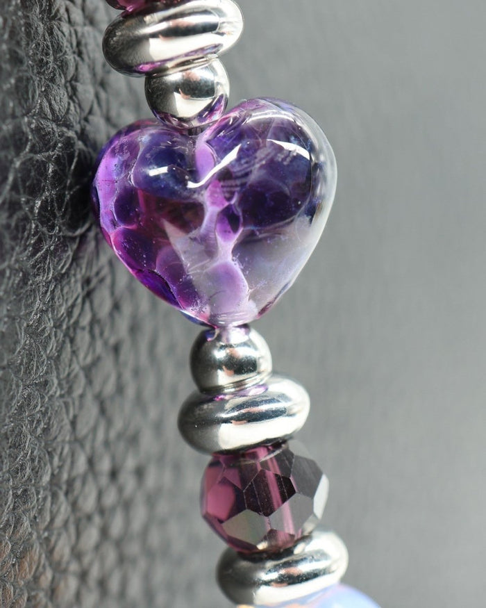 LD Keyfinder Petite Orchid Flutter featuring a handcrafted purple glass heart bead, faceted orchid glass, and opalite.