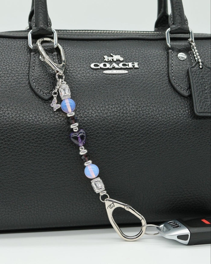 LD Keyfinder Petite Orchid Flutter featuring pink opalite, dark orchid glass beads, and a rhinestone butterfly charm.