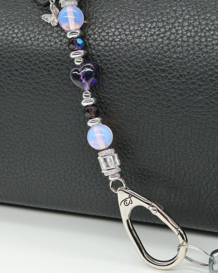 LD Keyfinder Petite Orchid Flutter with pink opalite, dark orchid glass beads, and a rhinestone butterfly charm.