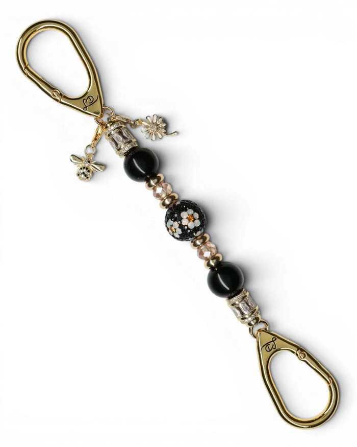 LD Keyfinder Petite Queen Bee II keychain with black obsidian beads, crystal daisy center, gold daisy charm, and bumblebee charm.