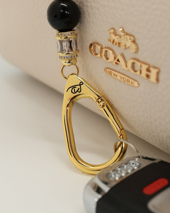 LD Keyfinder Petite Queen Bee II keychain with black obsidian, crystal beads, gold accents, and bumblebee charm.