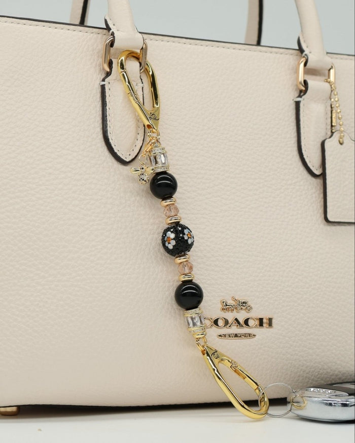 LD Keyfinder Petite Queen Bee II charm with black obsidian, crystal daisy bead, gold accents, and bumblebee charm.