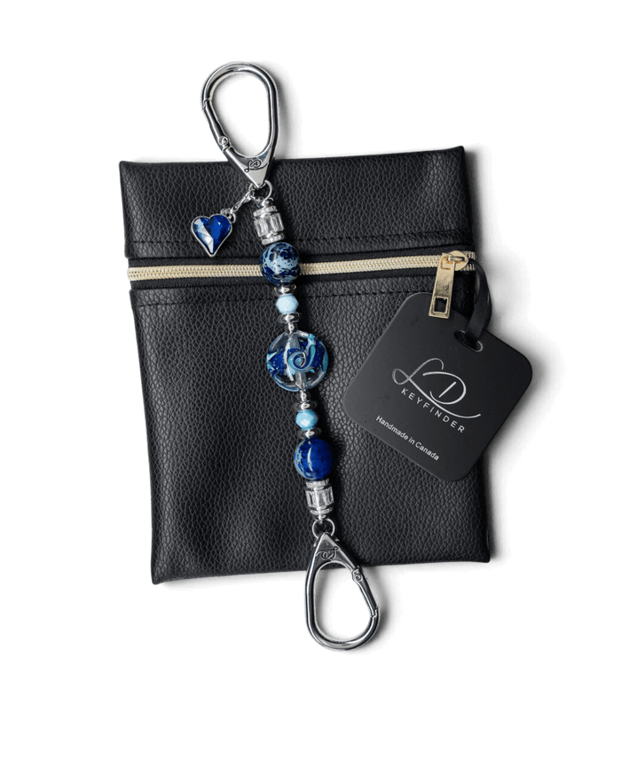LD Keyfinder Petite Sapphire Allure featuring blue artisan glass, jasper beads, and a sapphire heart charm on a pouch.
