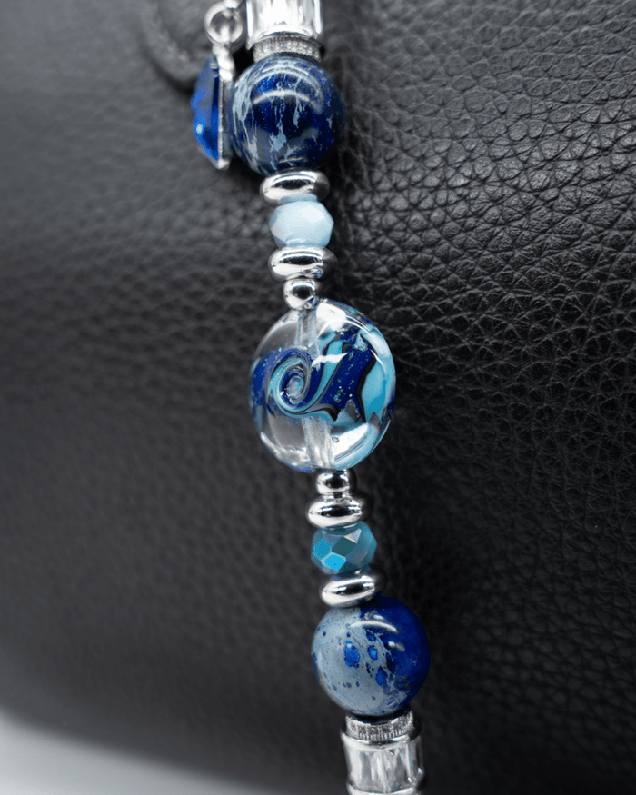 LD Keyfinder Petite Sapphire Allure featuring artisan blue glass, blue jasper, and platinum-plated accents on leather.