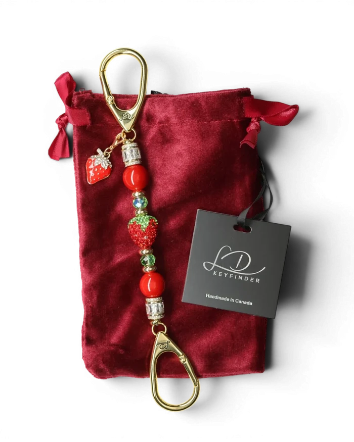 LD Keyfinder Petite Strawberry Fields keychain with red shell pearls, crystal strawberry bead, and gold-plated charm.