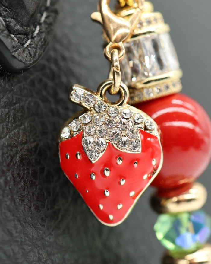 LD Keyfinder Petite Strawberry Fields charm with red shell pearls, green glass beads, and gold-plated strawberry.