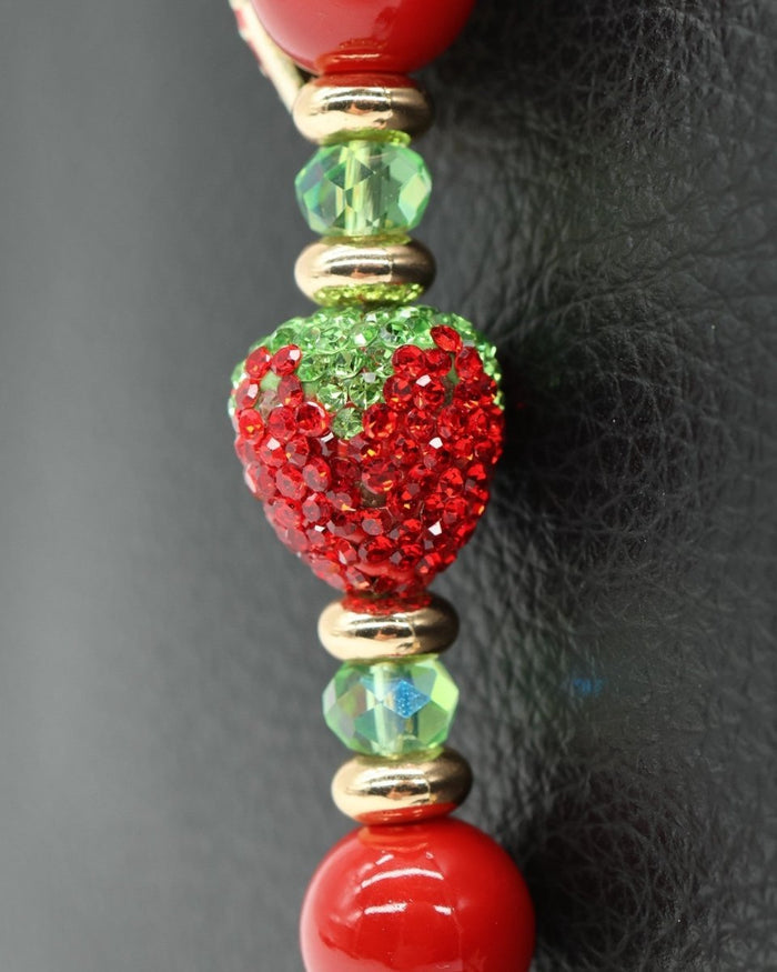 LD Keyfinder Petite Strawberry Fields keychain with red shell pearls, green glass beads, and crystal strawberry charm.