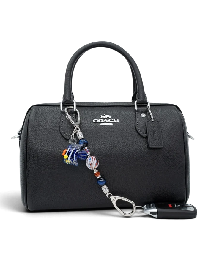 LD Keyfinder Petite Tropical Tango accessory with blue tiger eye and artisan glass beads attached to a black handbag