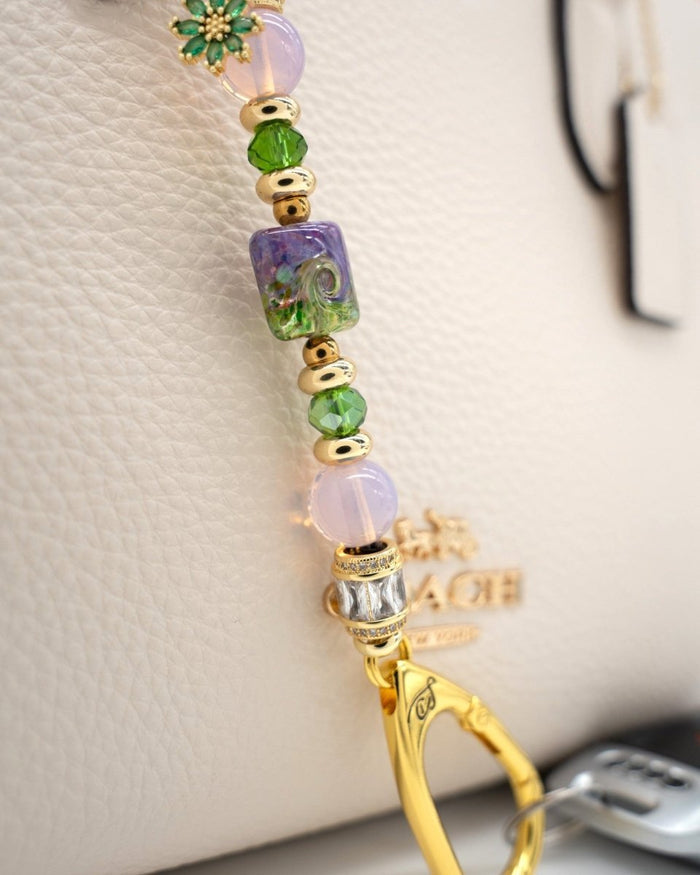 LD Keyfinder Petite Verdant Bloom featuring artisan lampwork glass, pink opalite, green crystals, and gold-plated charm.