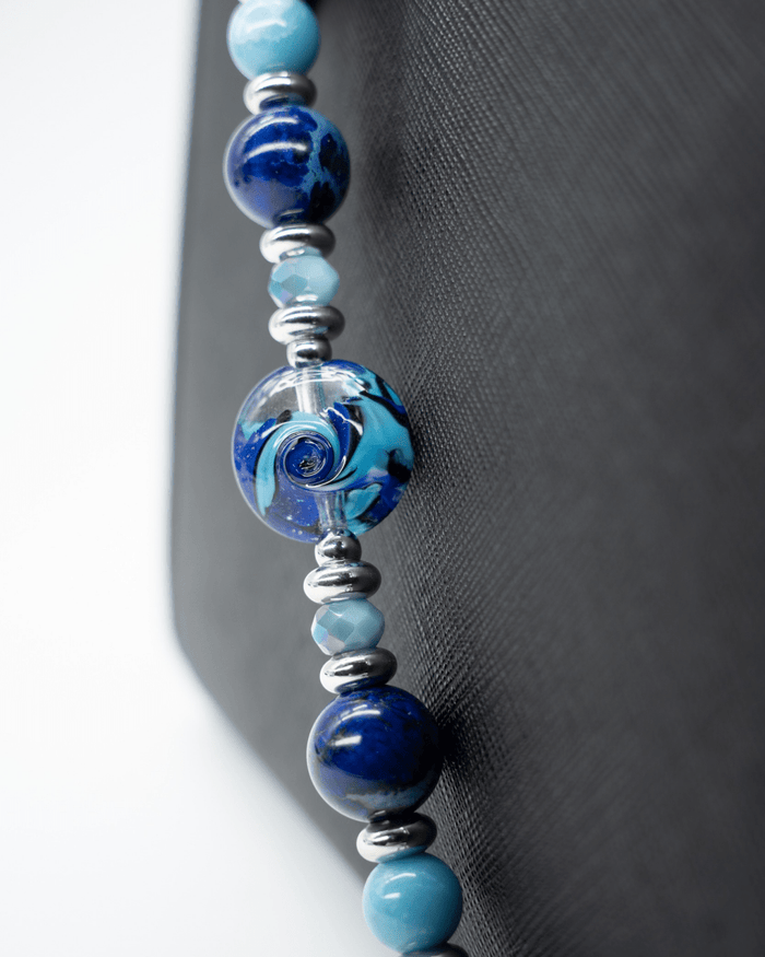 LD Keyfinder Sapphire Allure beaded accessory featuring artisan glass, blue jasper, larimar, and platinum-plated accents.