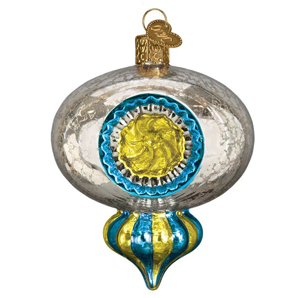 Decorative glass reflector ornament with blue and gold design on a white background