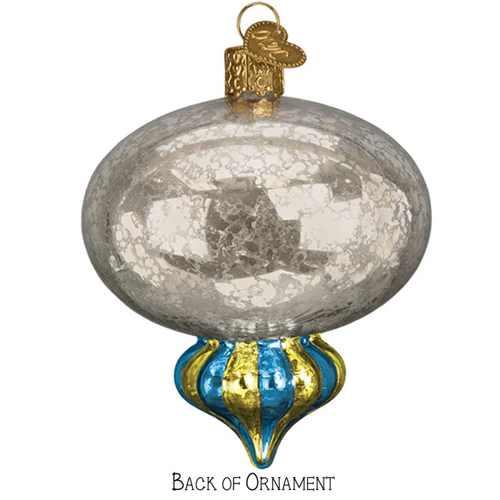 Decorative glass reflector ornament with gold and blue accents on a white background back of ornament