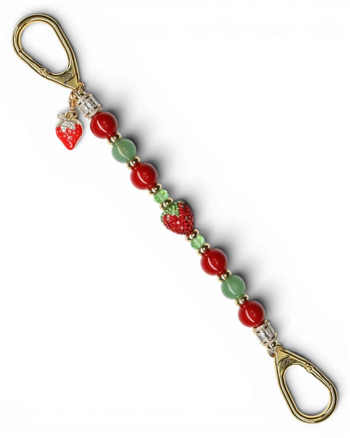 LD Keyfinder Strawberry Fields keychain with red shell pearls, green aventurine, crystal strawberry, and gold charm.