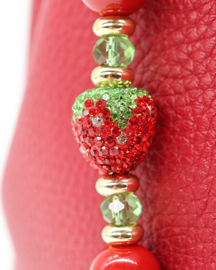 LD Keyfinder Strawberry Fields accessory with red shell pearls, green aventurine, and a crystal strawberry bead.
