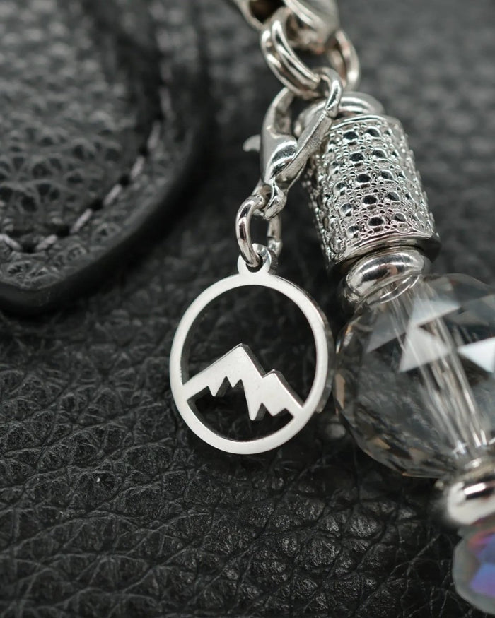 Polished stainless mountain peak charm