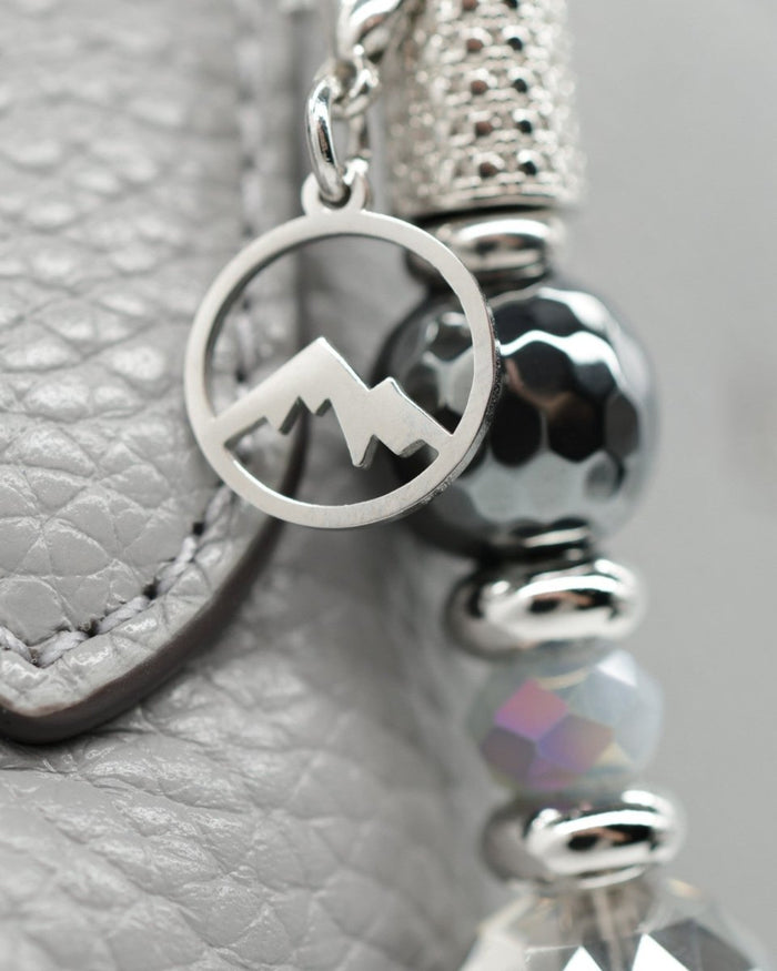 Polished stainless mountain charm