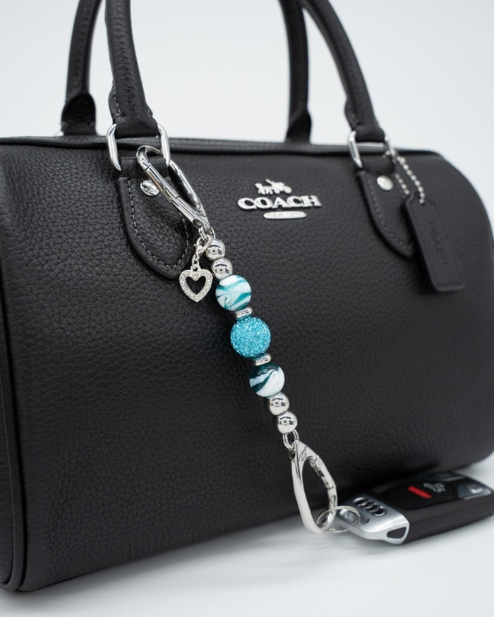 LD Keyfinder Teal My Heart-Mini keychain with teal swirl glass beads, crystal center, and silver heart charm on bag