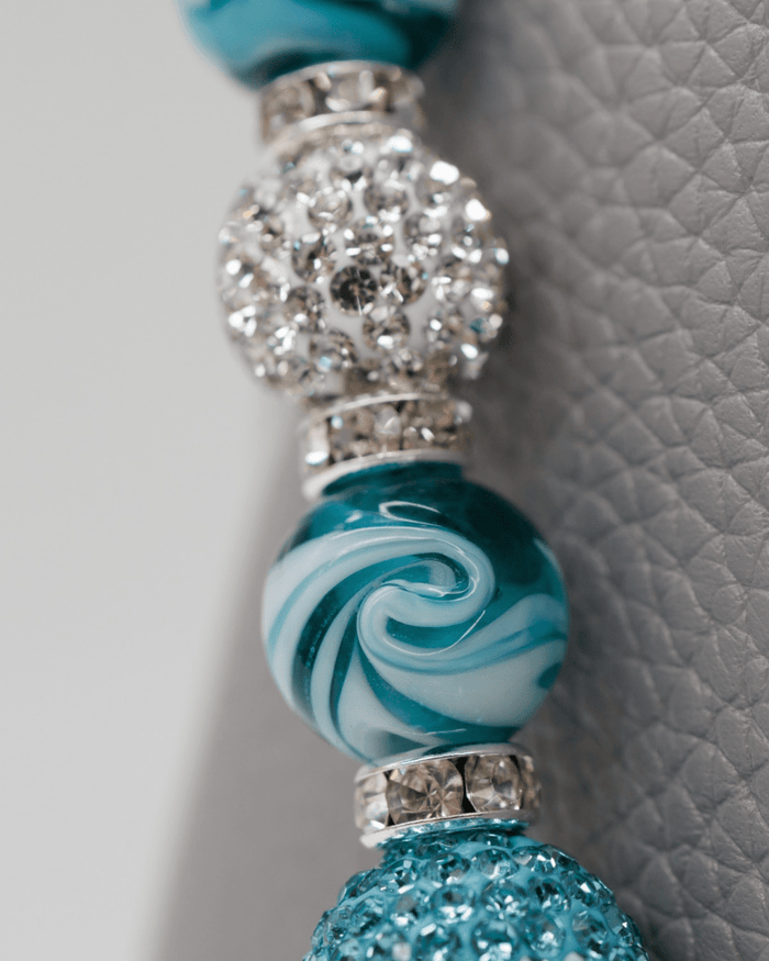 Hand-blown teal swirl glass