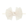 A skinny nylon headband with a pleated oatmeal tulle bow in the center, displayed against a white background.