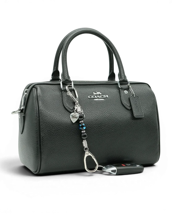 LD Keyfinder Whisker Dreams-Mini beaded accessory with black obsidian and blue cat glass charm attached to a handbag